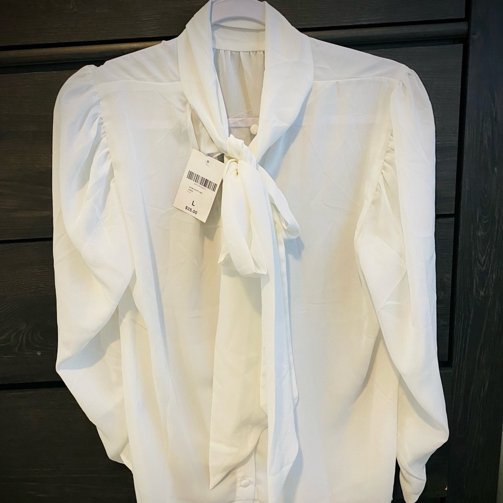 White long sleeve blouse with back buttons and neck bow